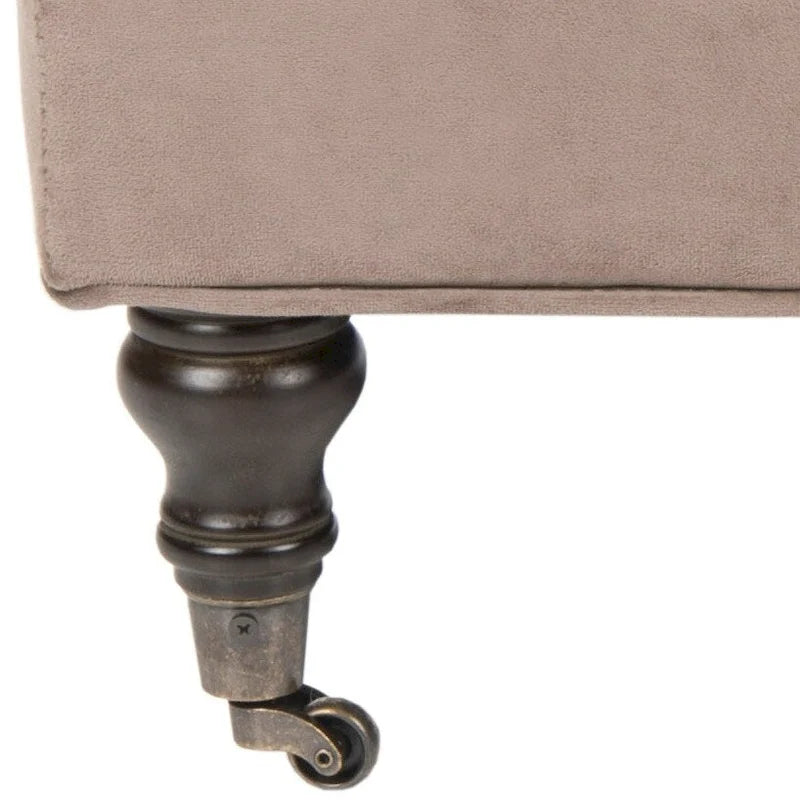 Pouf cocktail con bottoni trapuntati e gambe in legno