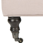 Pouf cocktail con bottoni trapuntati e gambe in legno